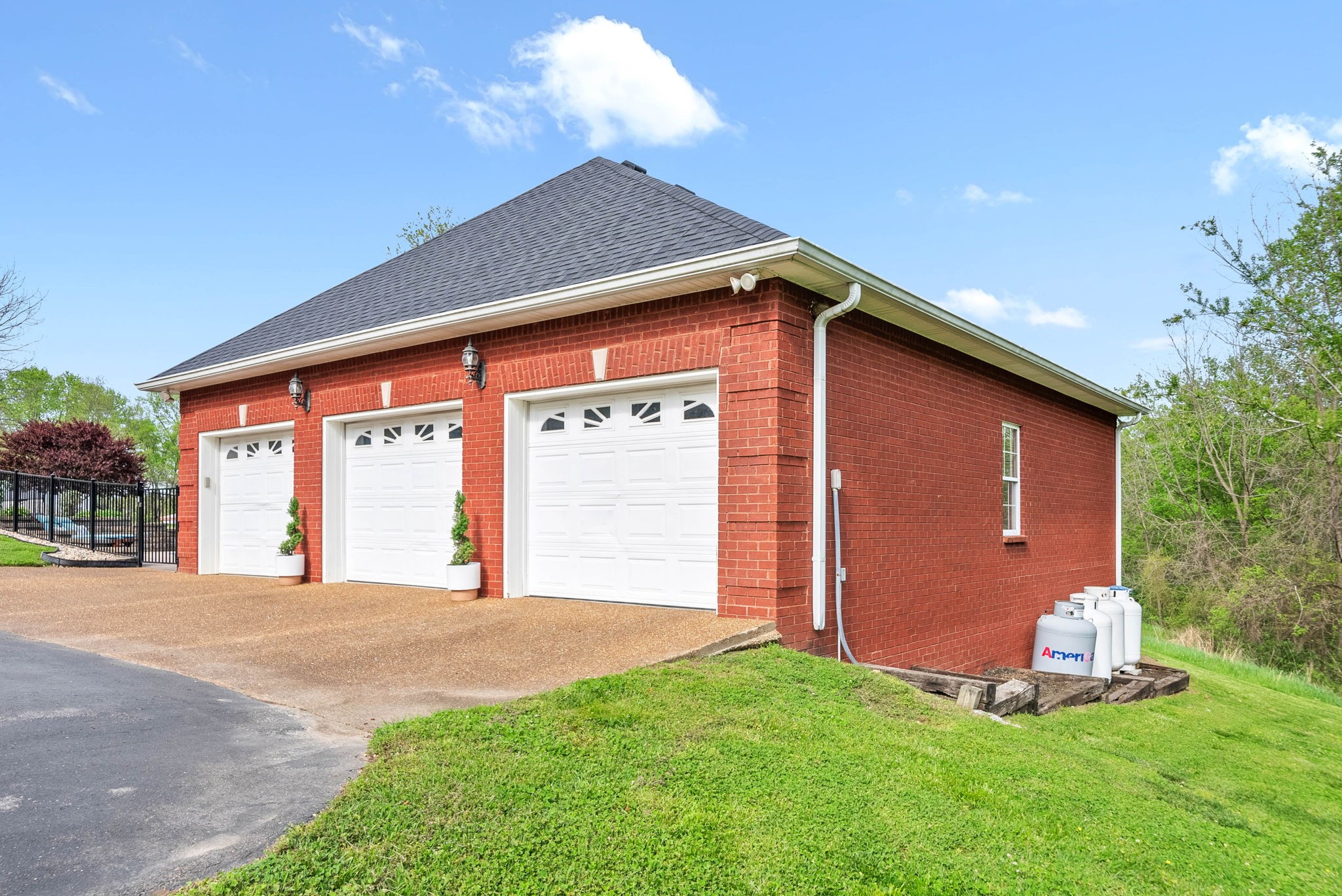 358 Ranch Road Portland, TN 37148 - Photo 36 of 43 a front view of a house with a garden and yard