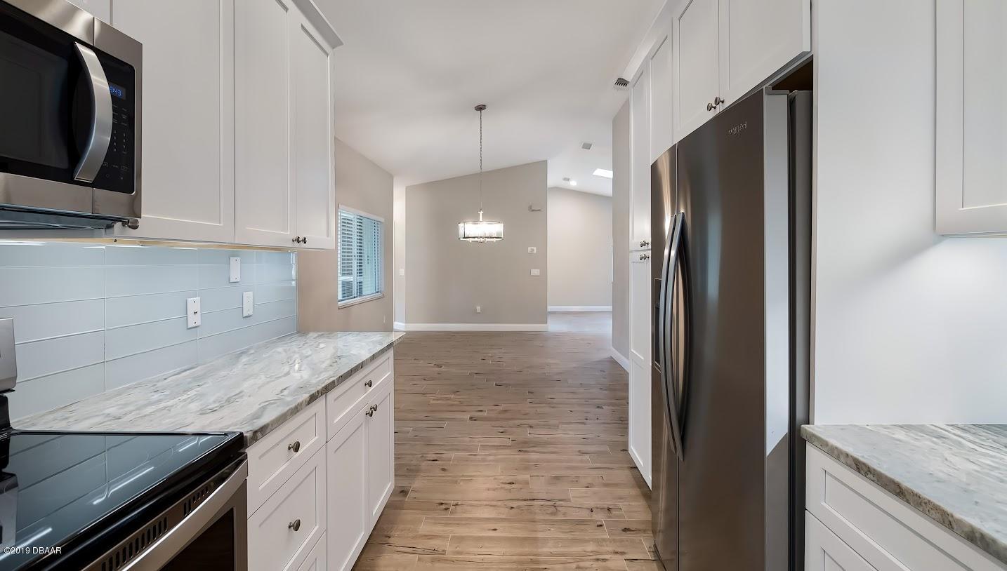 73 Glenview Avenue Ponce Inlet, FL 32127 - Photo 8 of 36 Dining room from kitchen