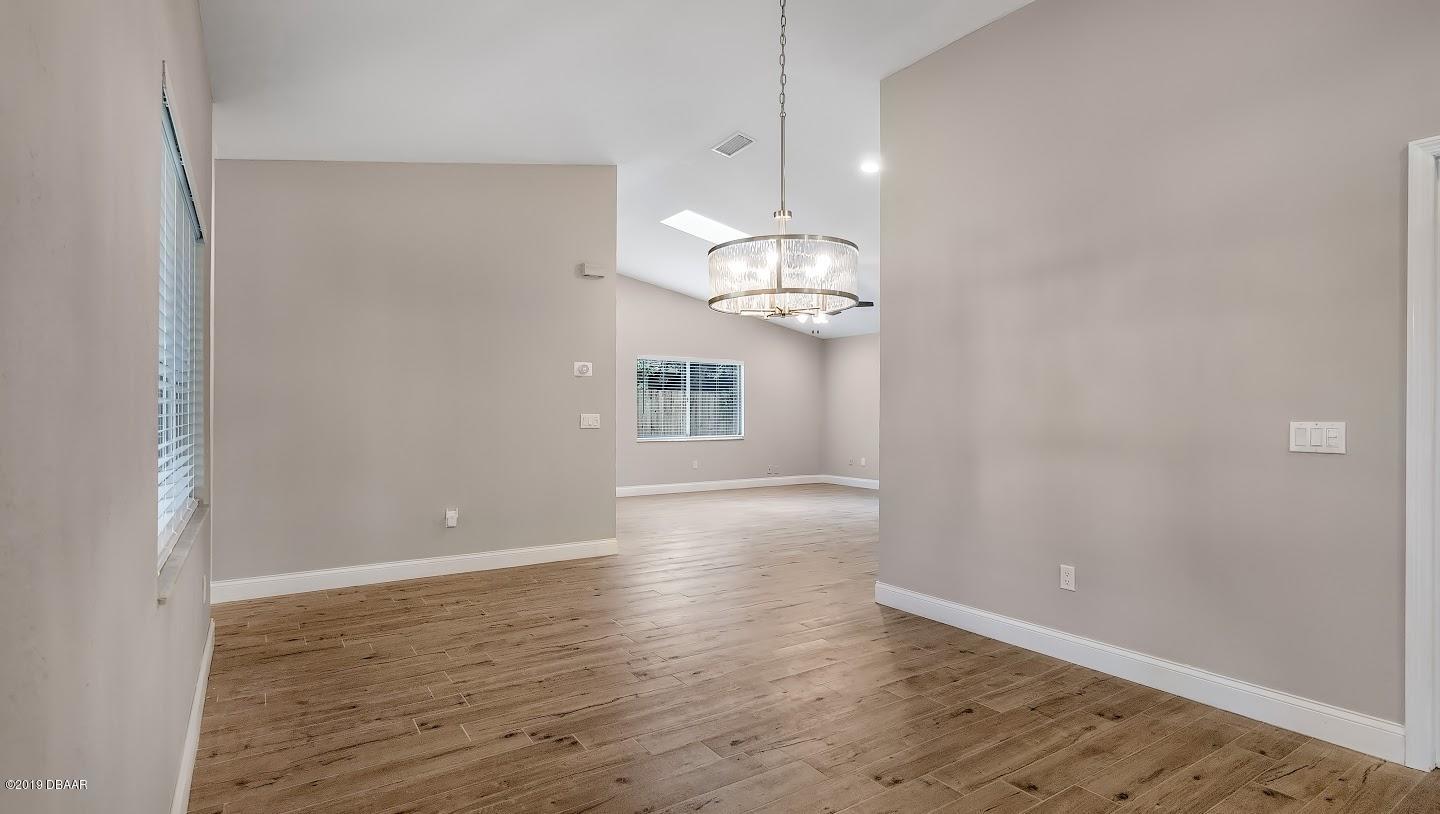 73 Glenview Avenue Ponce Inlet, FL 32127 - Photo 10 of 36 Living room and dining room
