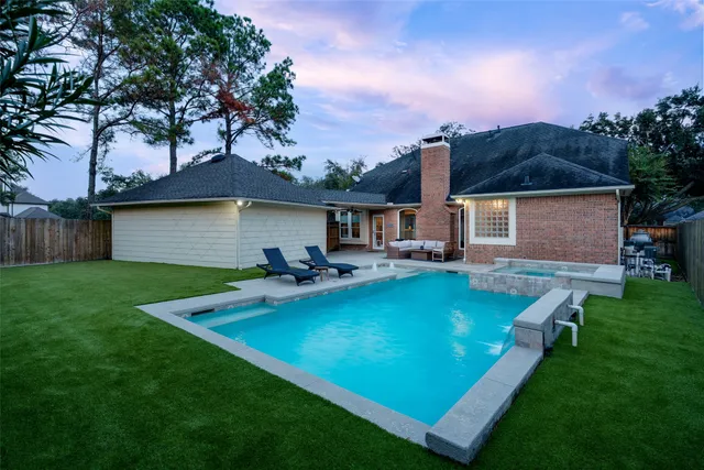 a view of a house with a yard porch and sitting area