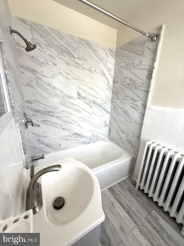a bathroom with a sink and mirror
