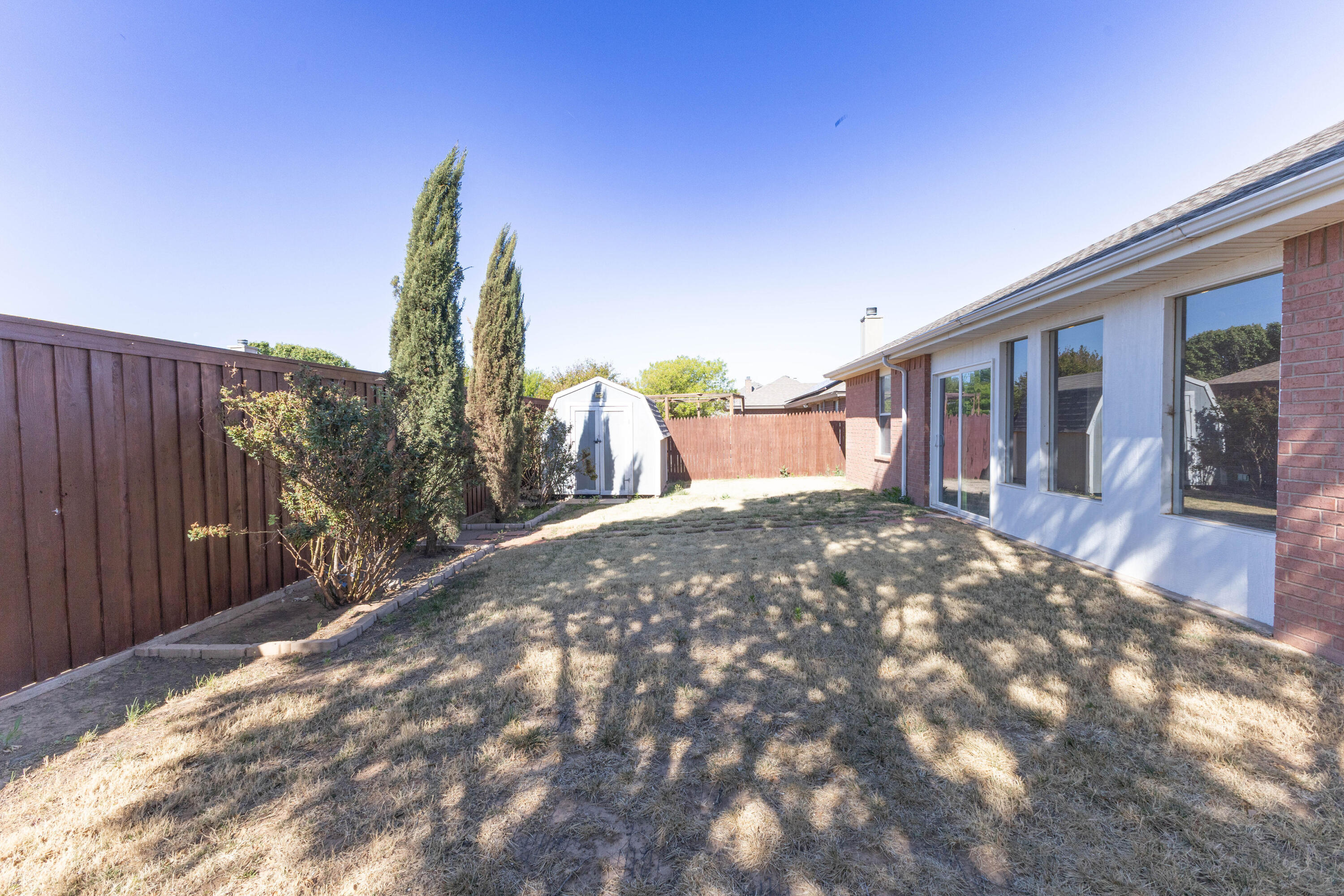 5917 88th Place Lubbock, TX 79424 - Photo 17 of 18 a view of a house with a backyard