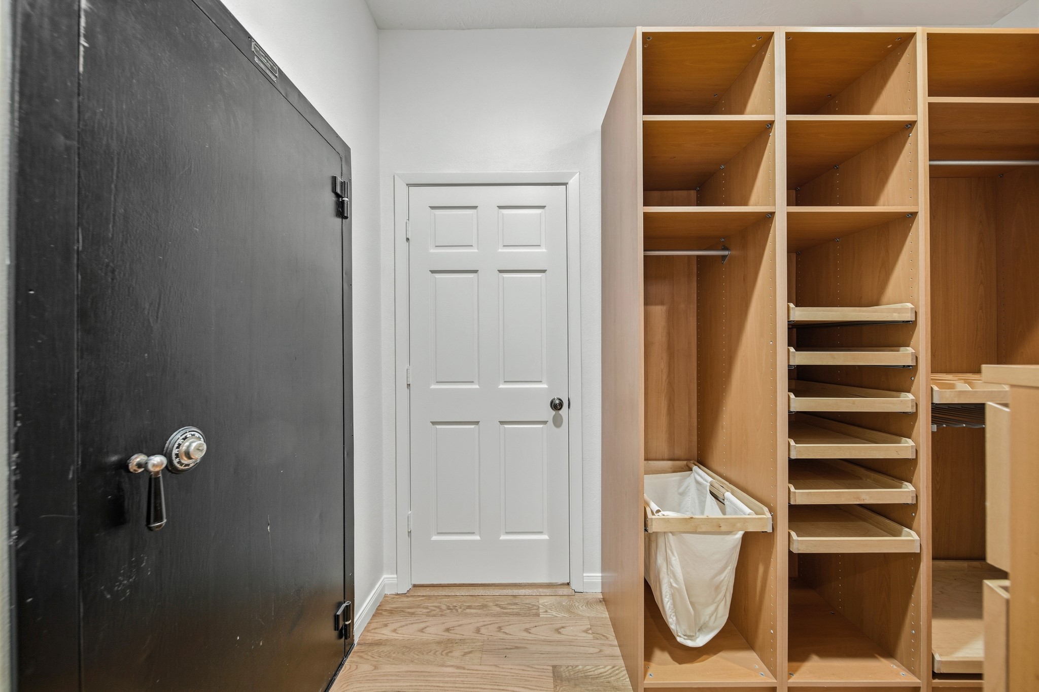 41712 Harpers Church Road Hempstead, TX 77445 - Photo 29 of 50 Large walk-in Safe! Abundant storage in this custom Primary Suite closet system including pull out shelving, drawers and seasonal hanging space