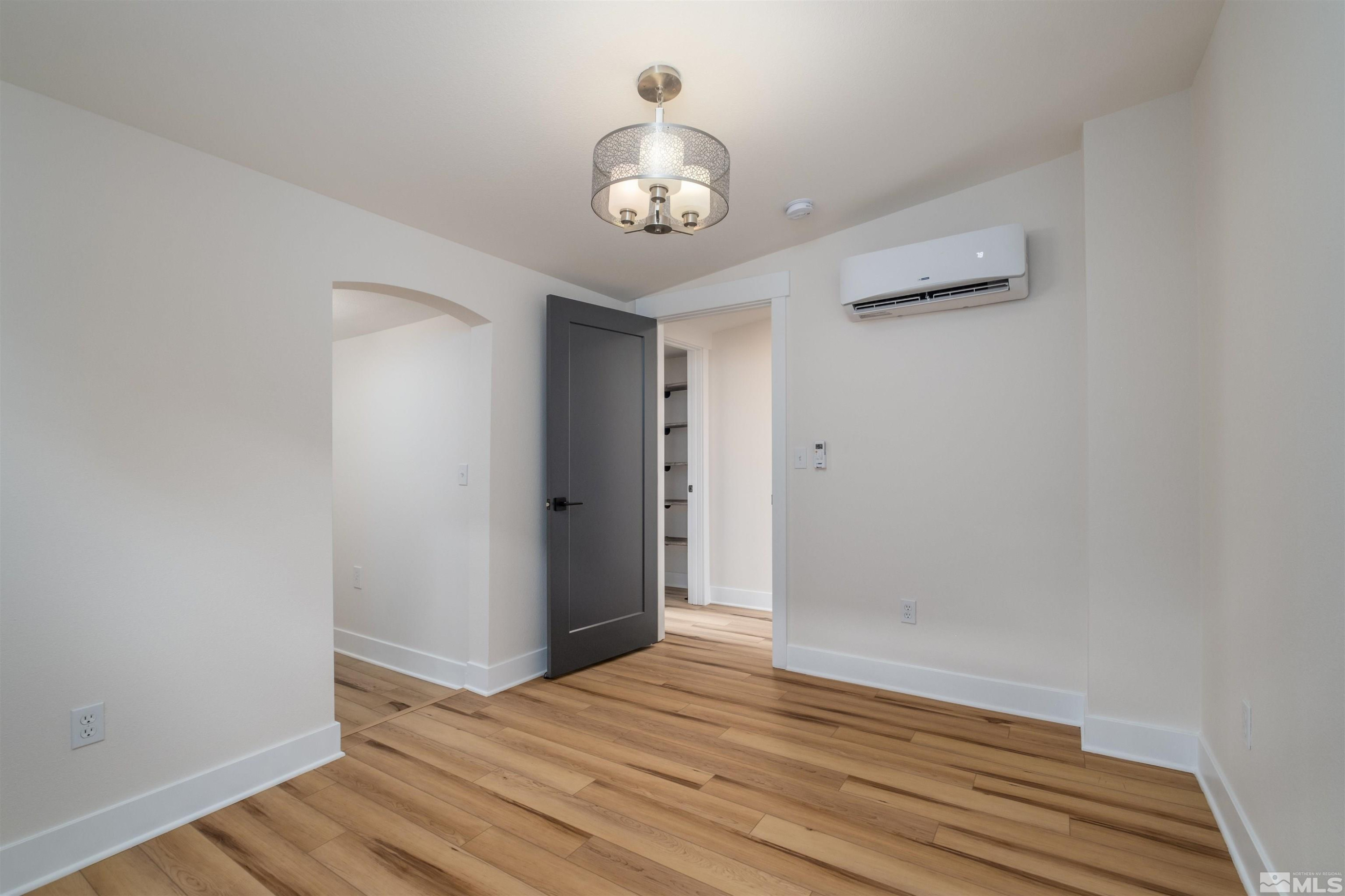 1401 Locust Street Reno, NV 89502 - Photo 19 of 29 a view of an empty room with wooden floor