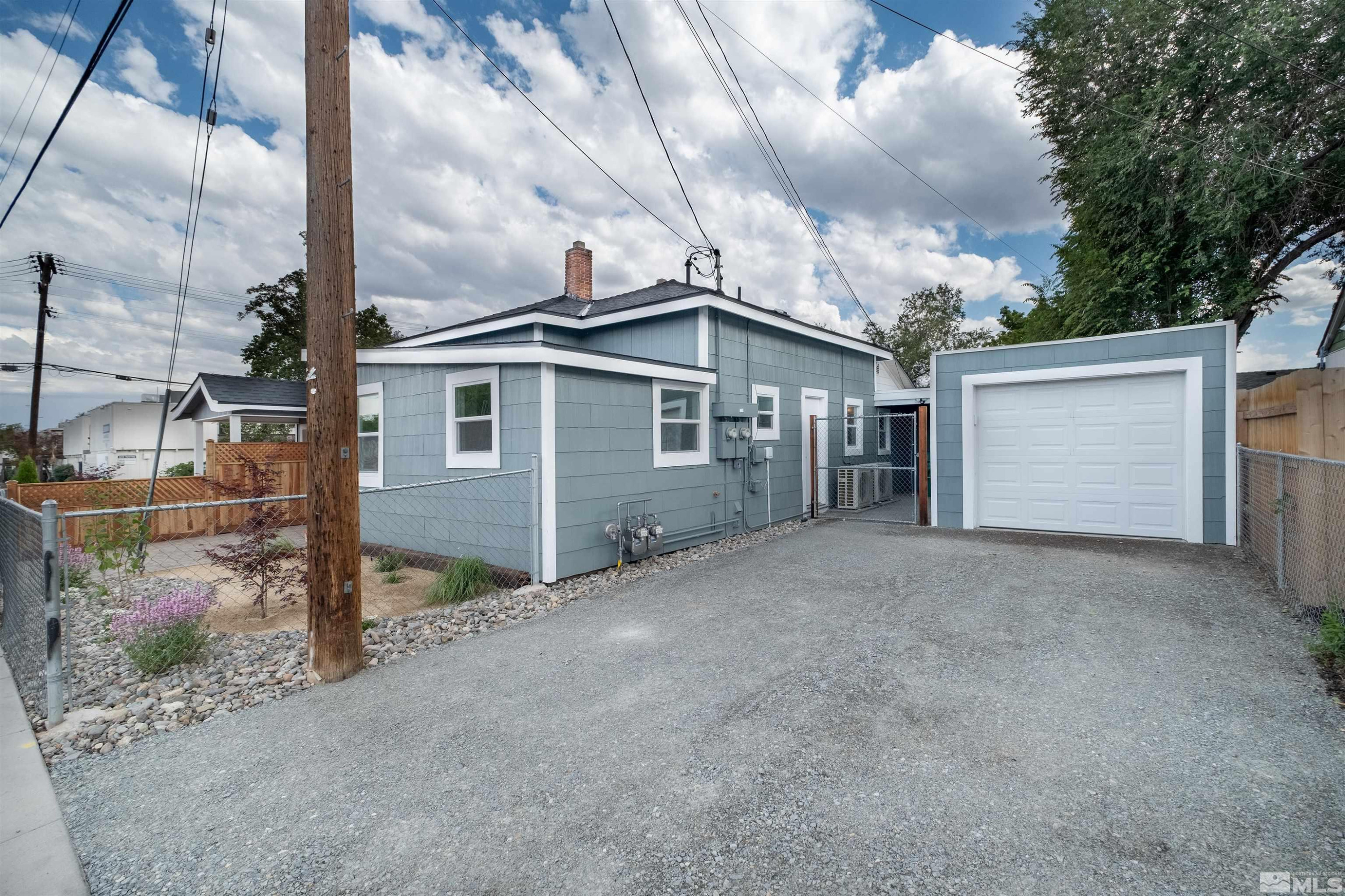 1401 Locust Street Reno, NV 89502 - Photo 8 of 29 a view of a house with a backyard and garage
