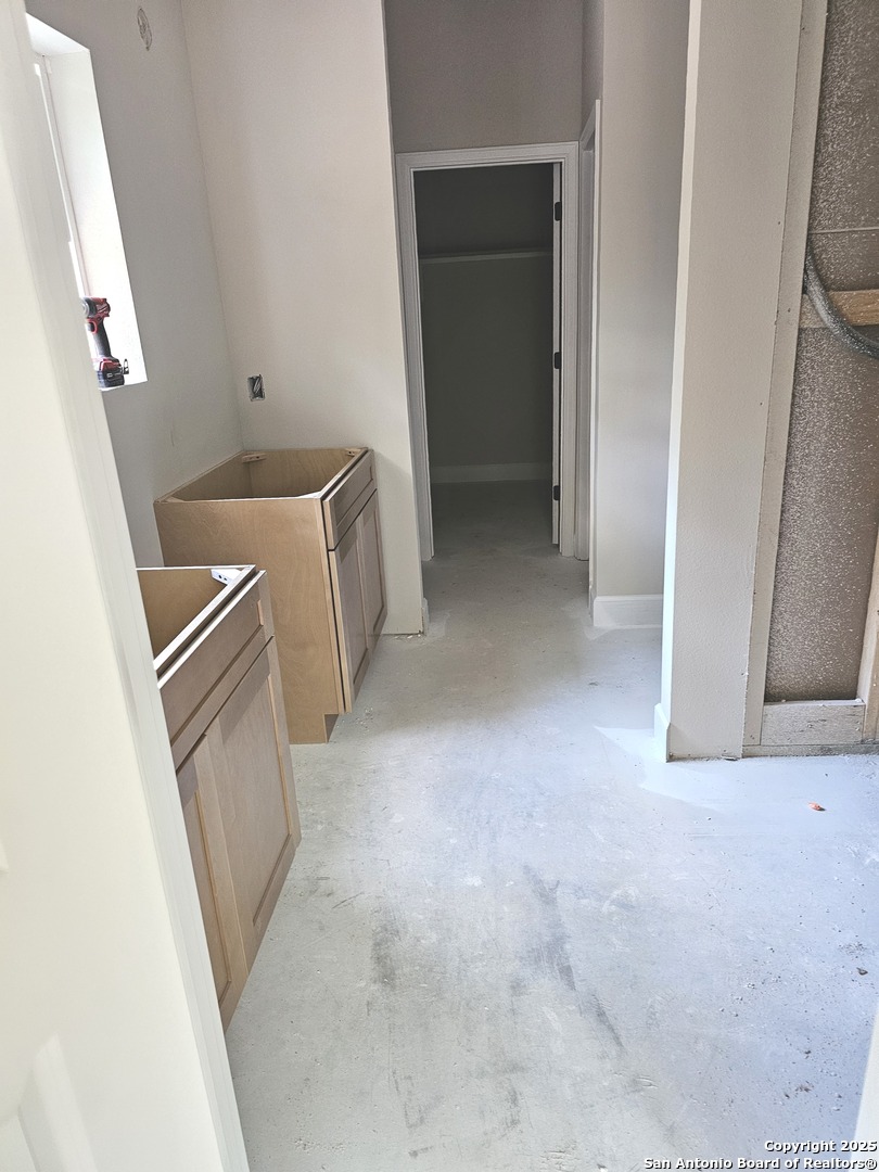 628 Winding River Lane Spring Branch, TX 78070 - Photo 4 of 16 a view of a storage and utility room with washer and dryer