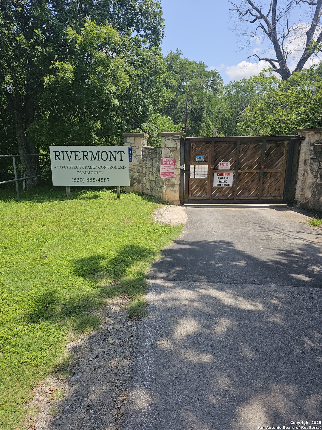 628 Winding River Lane Spring Branch, TX 78070 - Photo 7 of 16 a view of a park with trees and a sign board