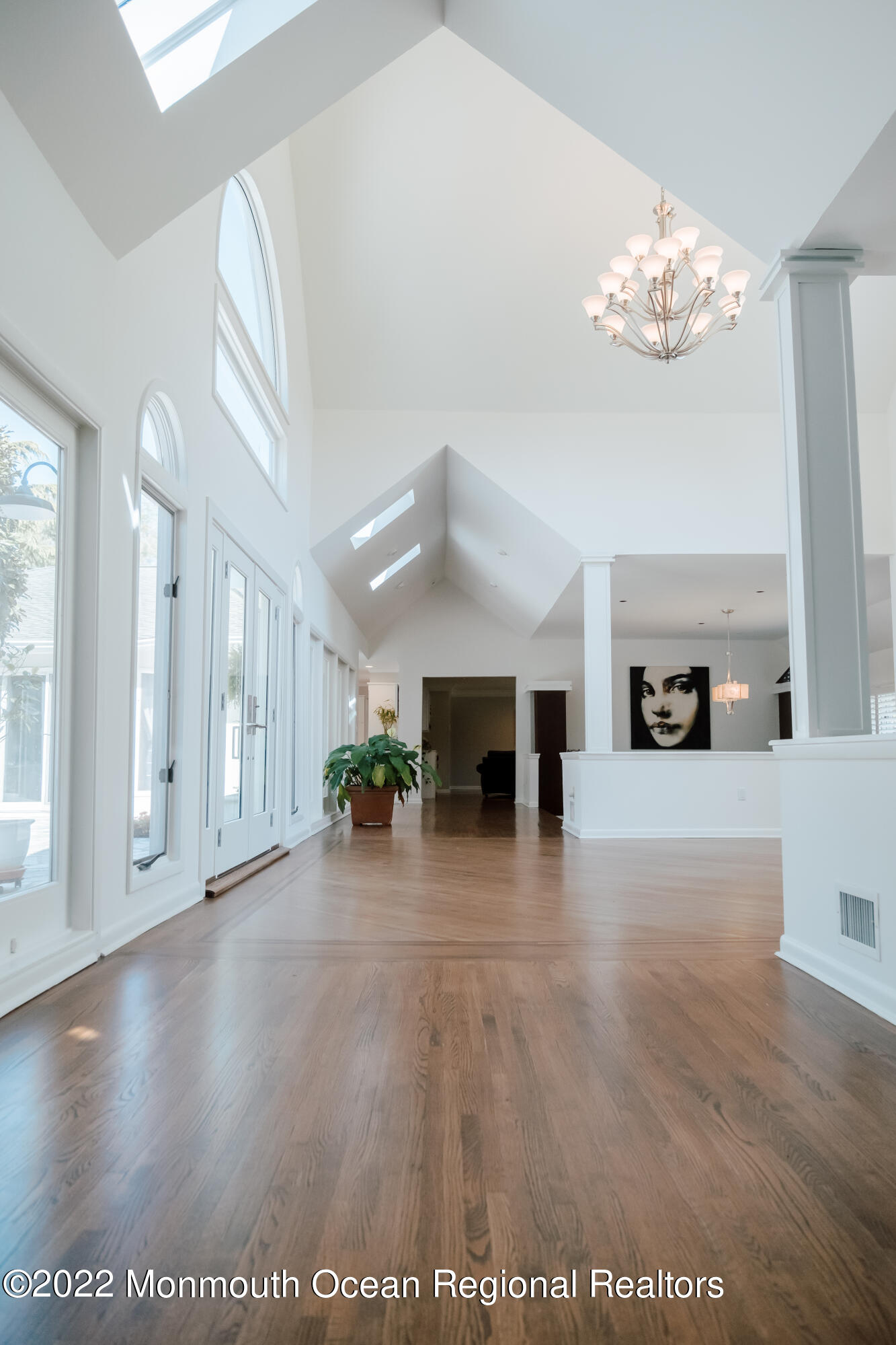 97 Mitchell Place Little Silver, NJ 07739 - Photo 14 of 21 a view of a livingroom with furniture a fireplace wooden floor and windows