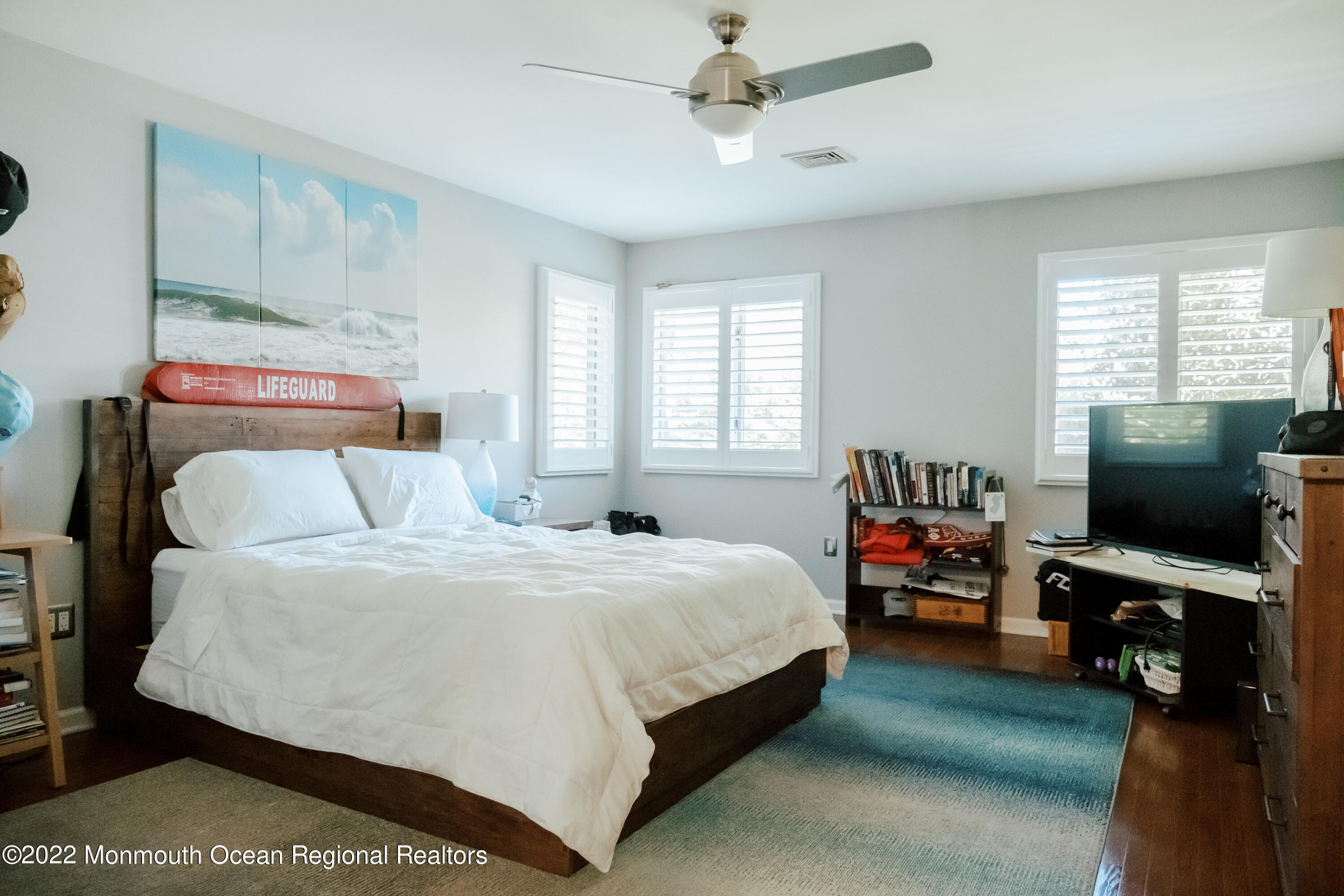 97 Mitchell Place Little Silver, NJ 07739 - Photo 9 of 21 a bedroom with a bed and a flat tv screen on dresser