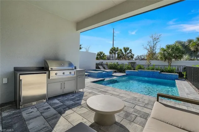 a view of a kitchen with a sink and a stove