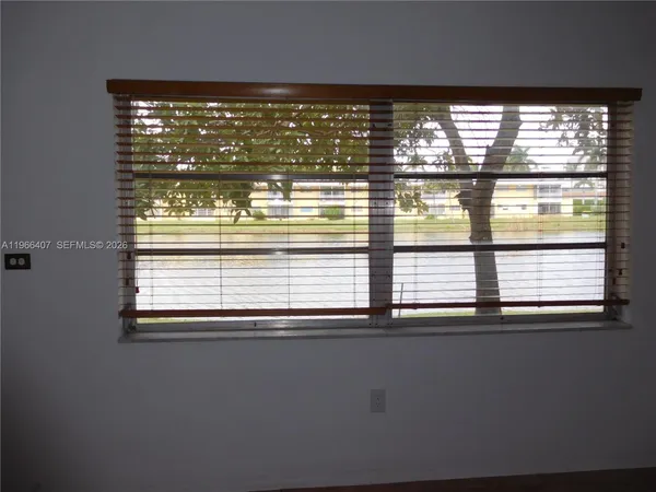 a view of a window and wooden floor