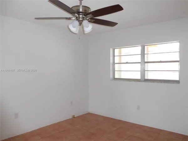 a view of a swimming pool with a table and chairs