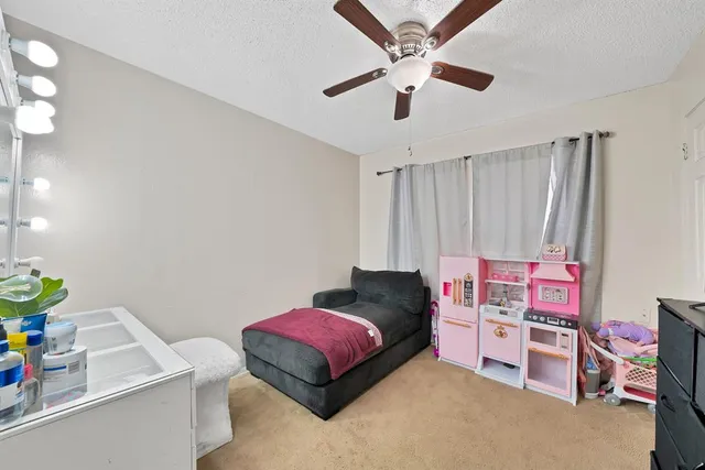 a bedroom with furniture and a baby crib