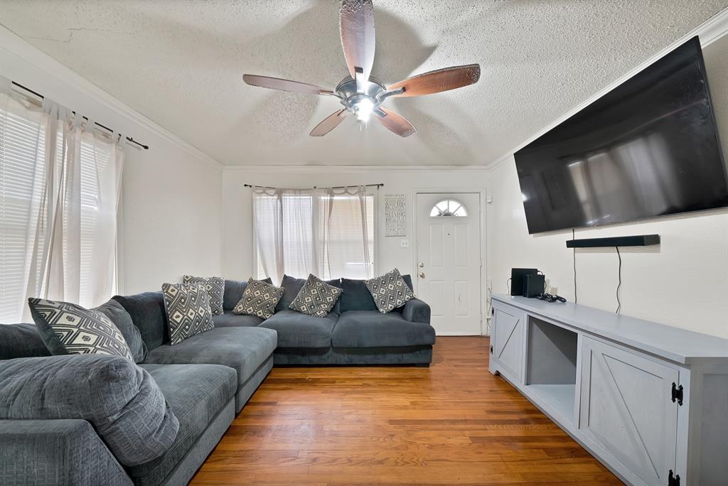 4153 Doyle Lane Lancaster, TX 75134 - Photo 5 of 20 a living room with furniture and a flat screen tv