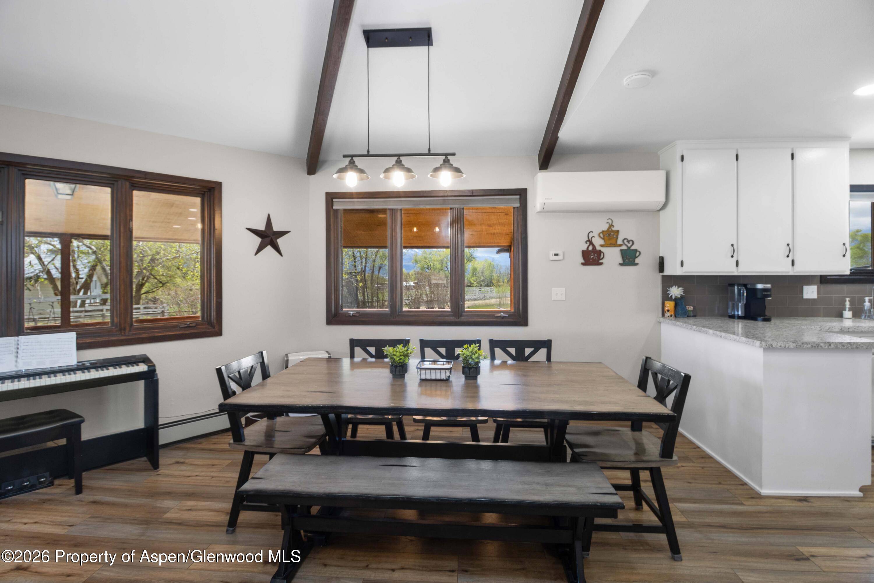 411 County Road 237 Silt, CO 81652 - Photo 26 of 45 a dining room with furniture and window