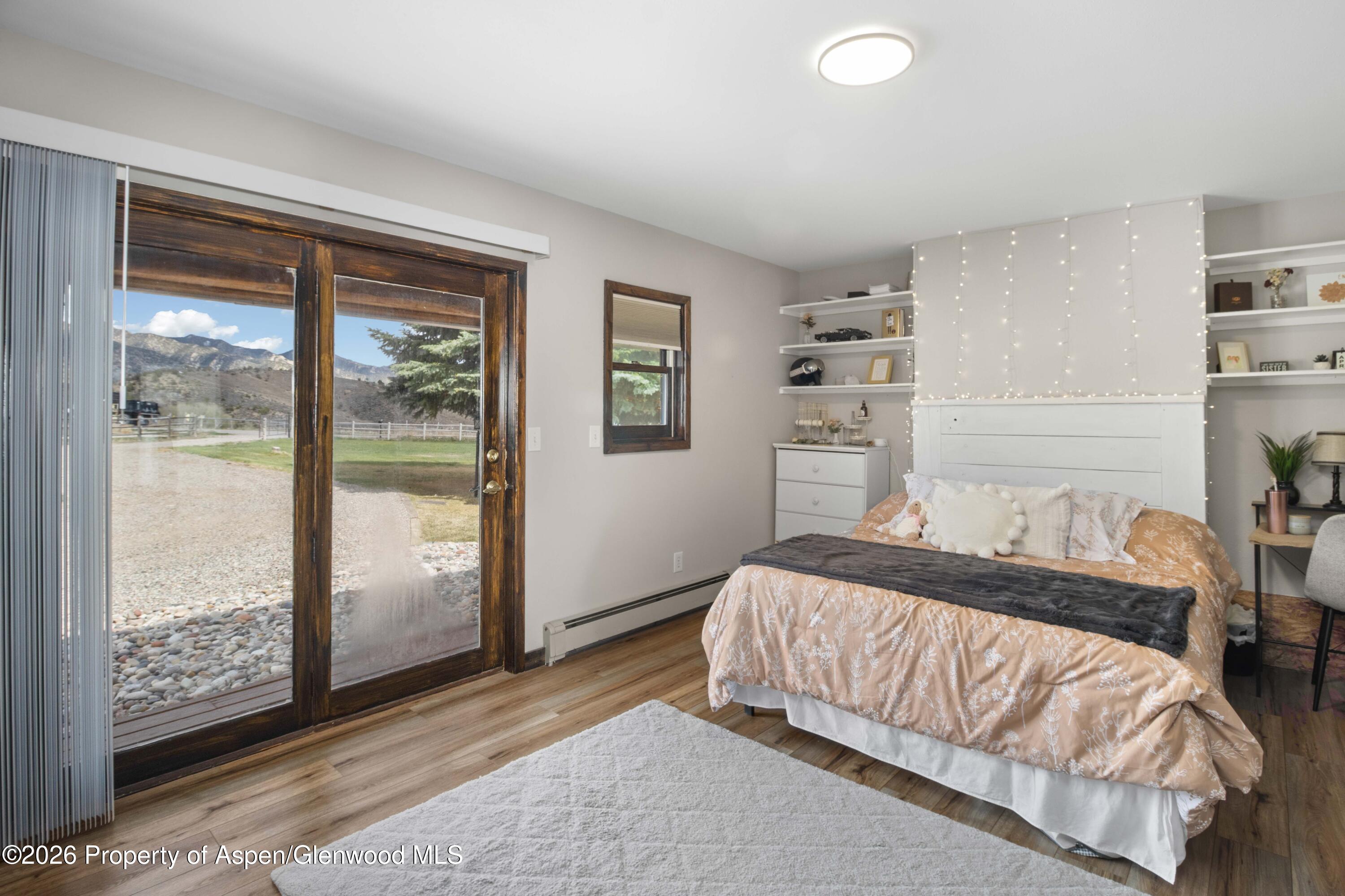 411 County Road 237 Silt, CO 81652 - Photo 29 of 45 a bedroom with a bed and a window