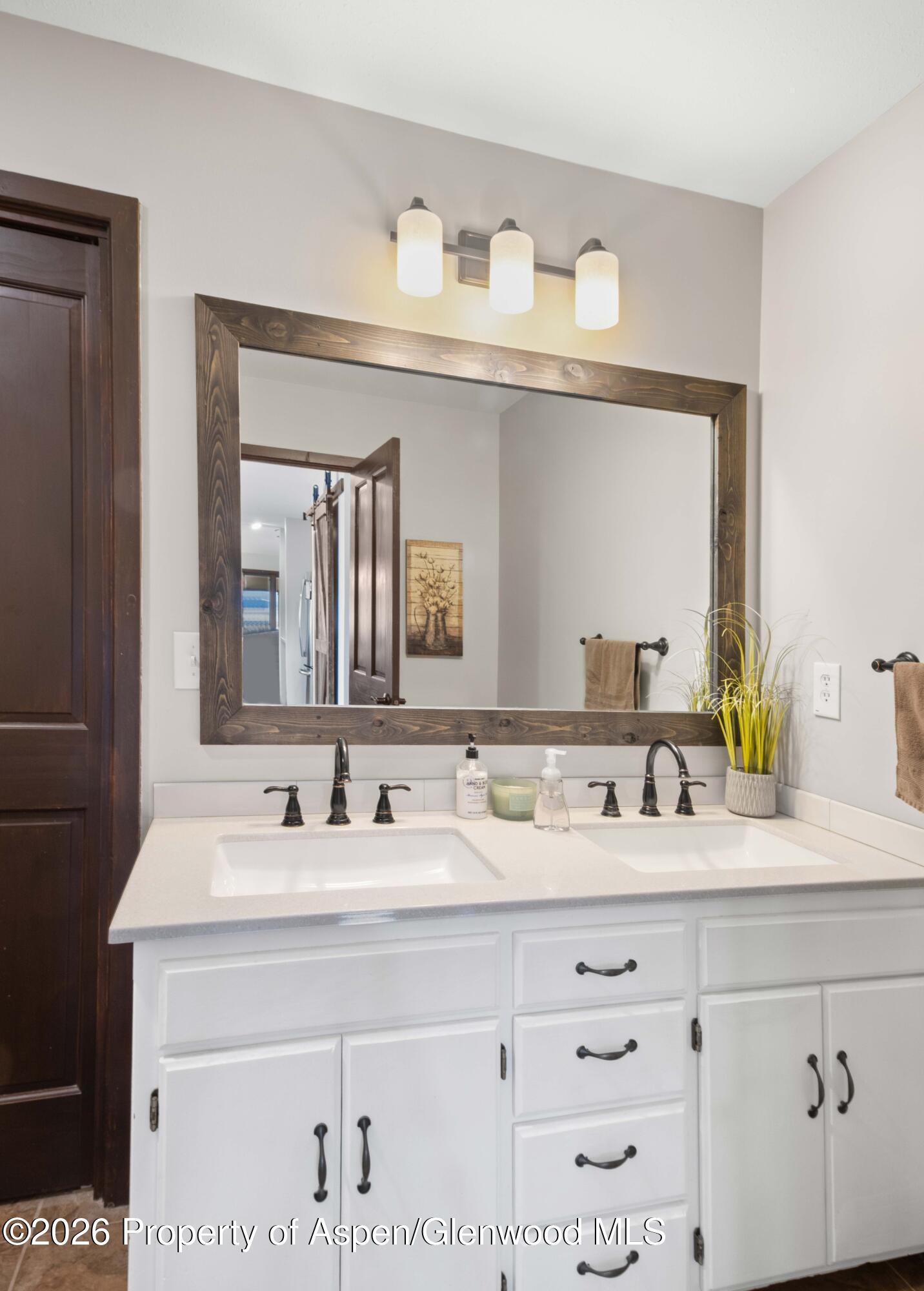 411 County Road 237 Silt, CO 81652 - Photo 30 of 45 a bathroom with double vanity sink and a mirror