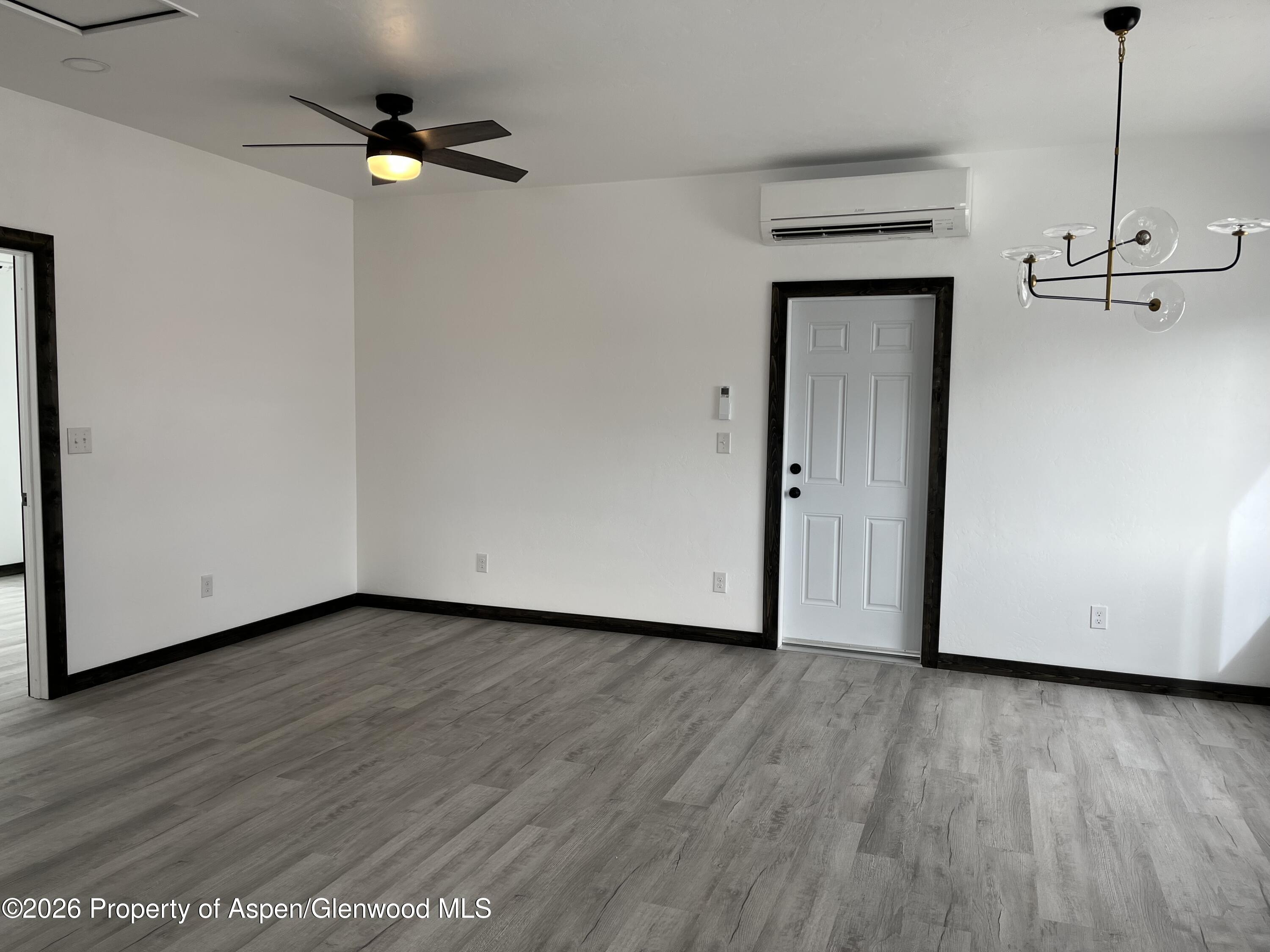 411 County Road 237 Silt, CO 81652 - Photo 39 of 45 a view of an empty room with wooden floor