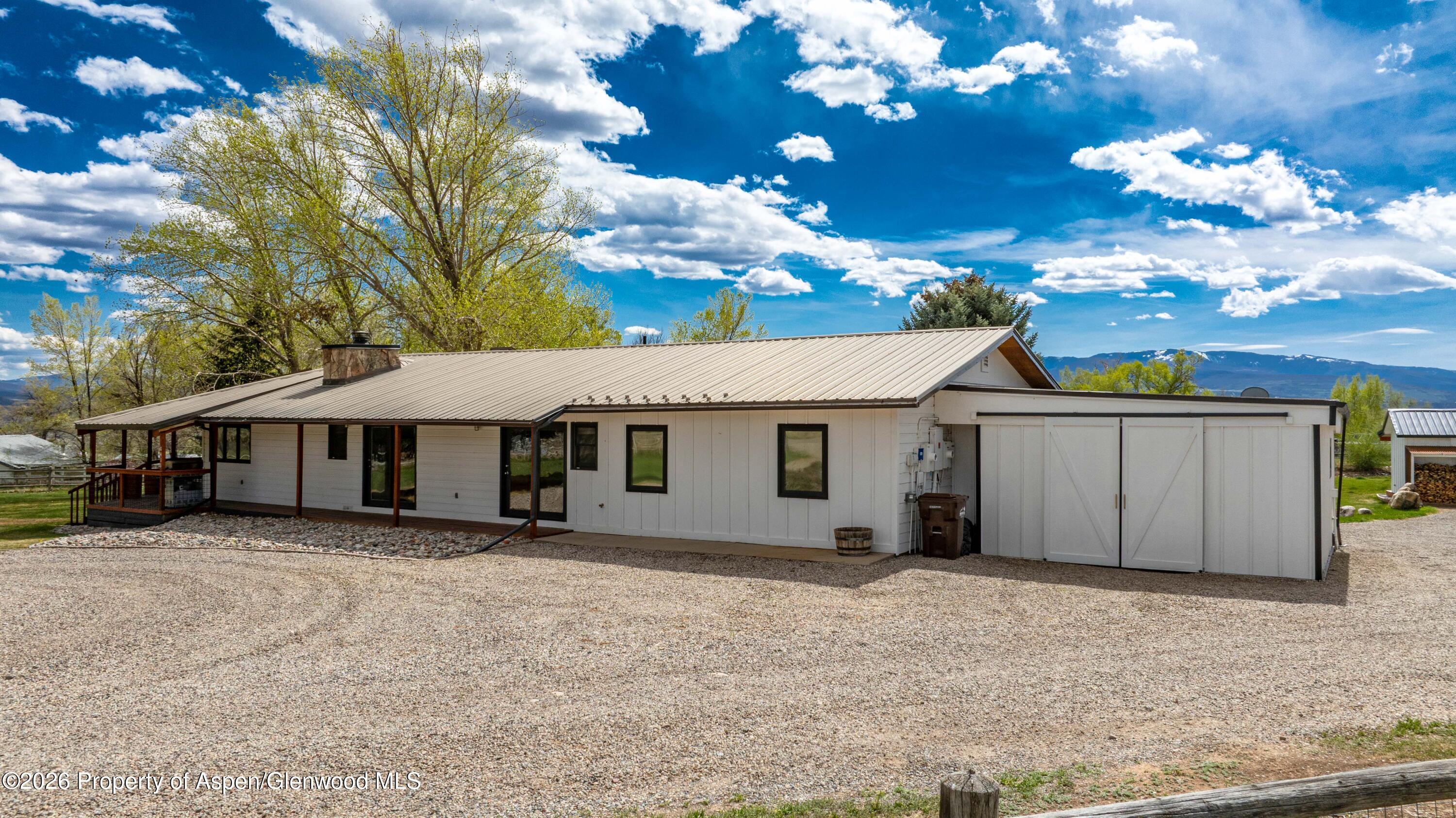 411 County Road 237 Silt, CO 81652 - Photo 4 of 45 a view of a house with a yard