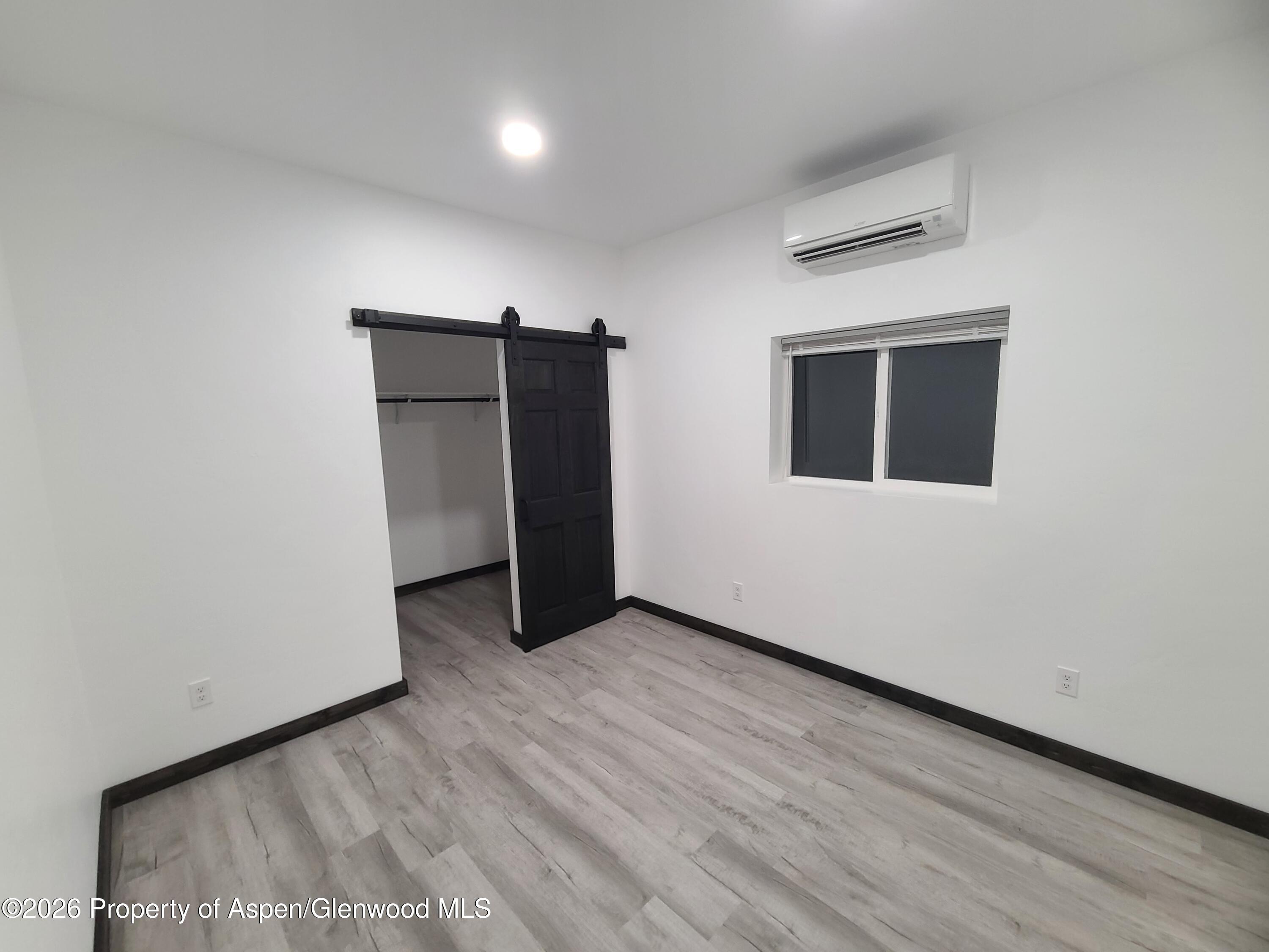 411 County Road 237 Silt, CO 81652 - Photo 43 of 45 a view of an empty room with wooden floor and closet