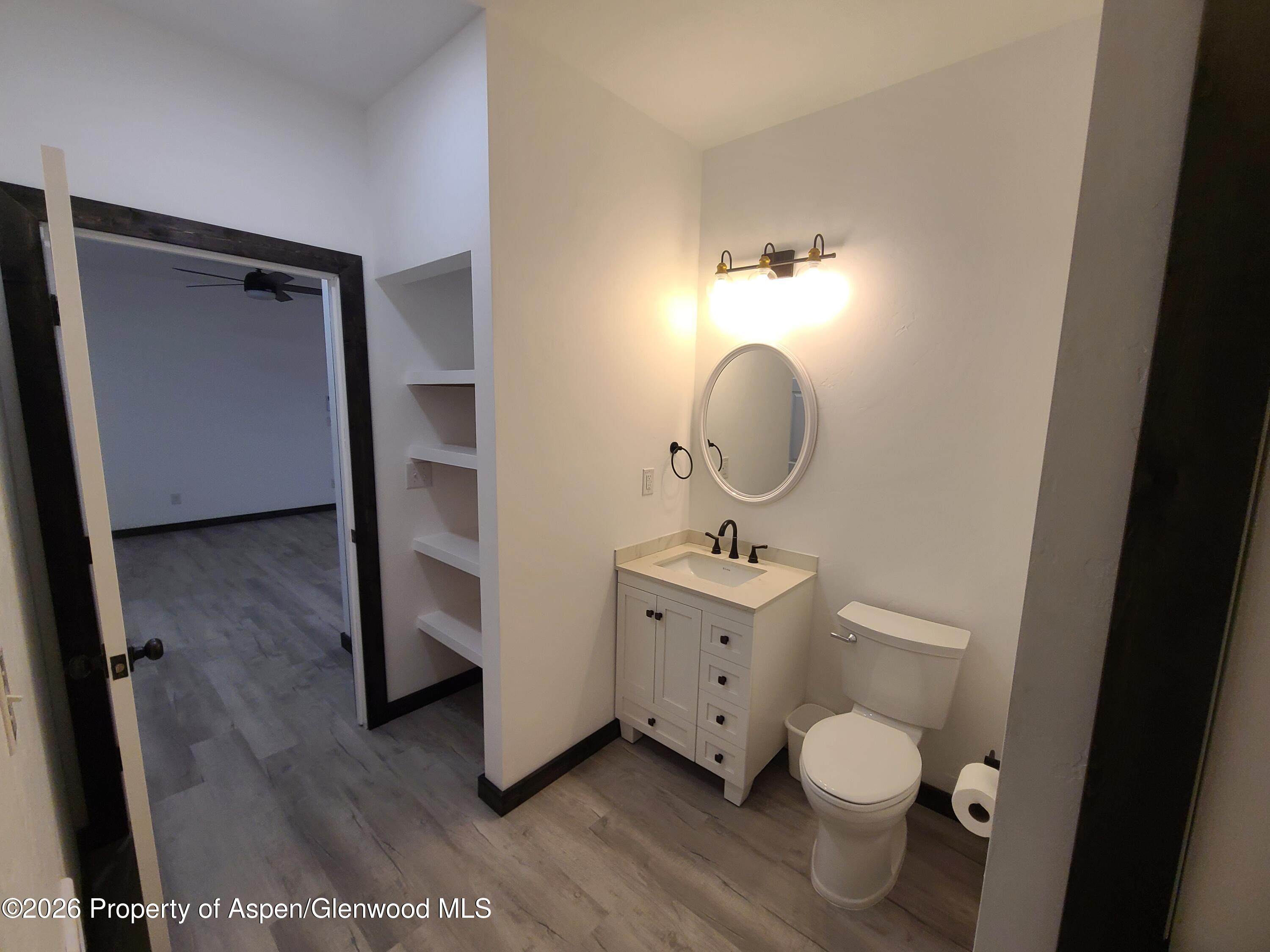 411 County Road 237 Silt, CO 81652 - Photo 44 of 45 a bathroom with a toilet a sink and mirror