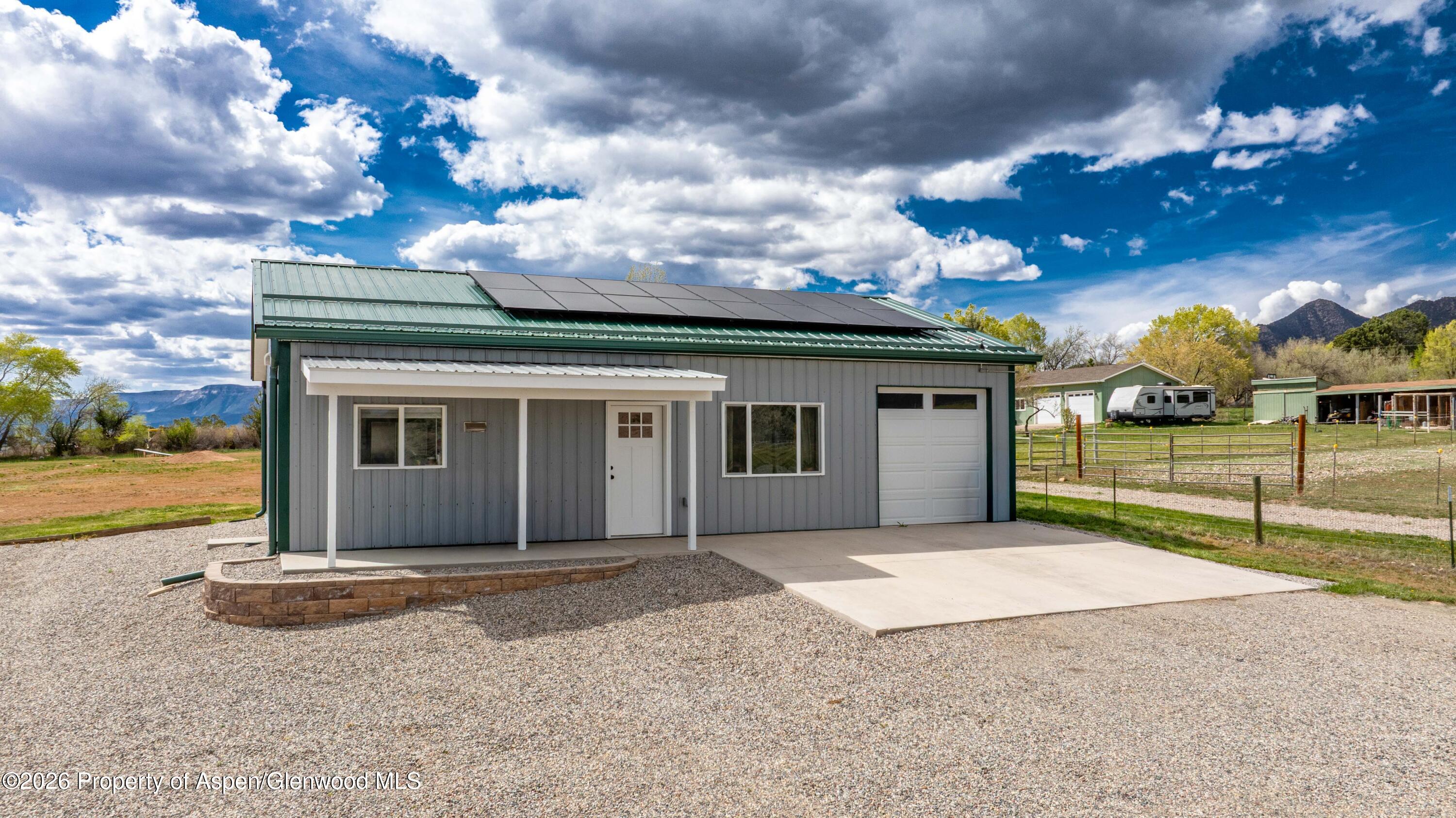 411 County Road 237 Silt, CO 81652 - Photo 7 of 45 a view of a house with a yard and potted plants