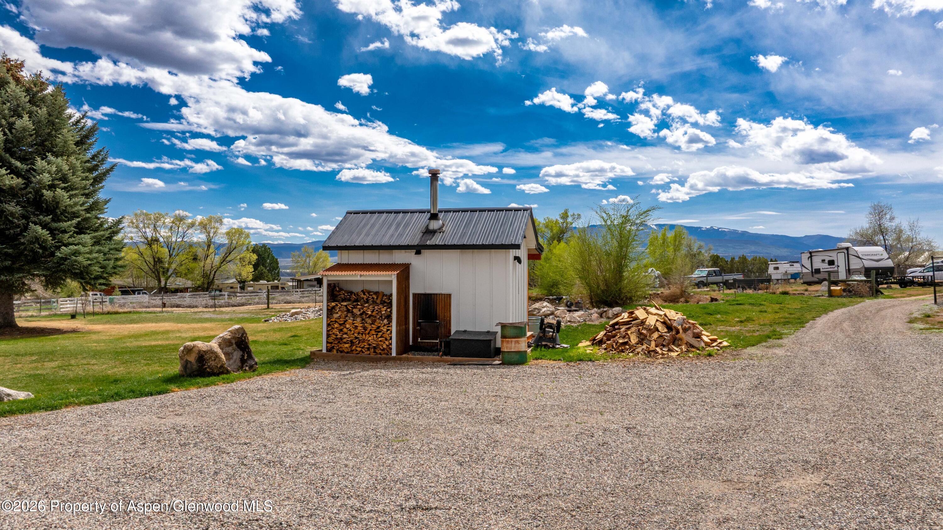 411 County Road 237 Silt, CO 81652 - Photo 9 of 45 a view of a house with a big yard and potted plants