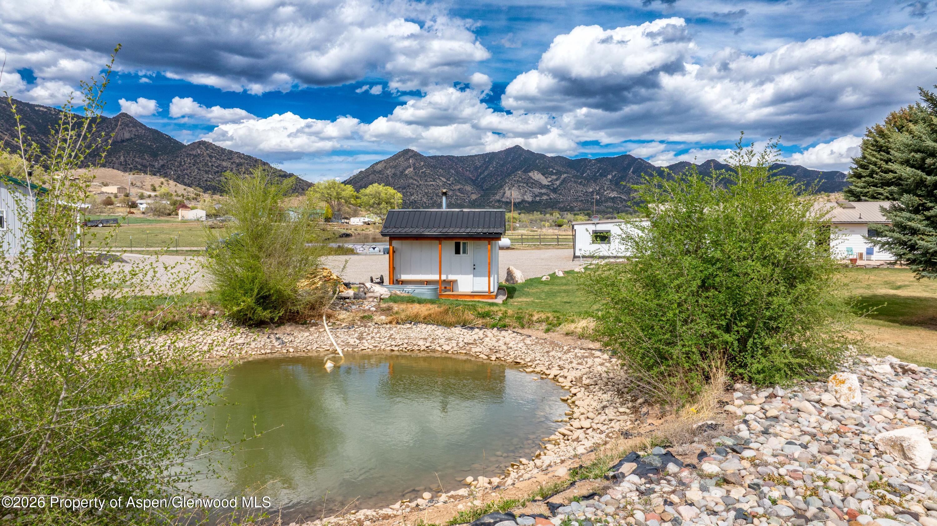 411 County Road 237 Silt, CO 81652 - Photo 10 of 45 a view of a lake with a building