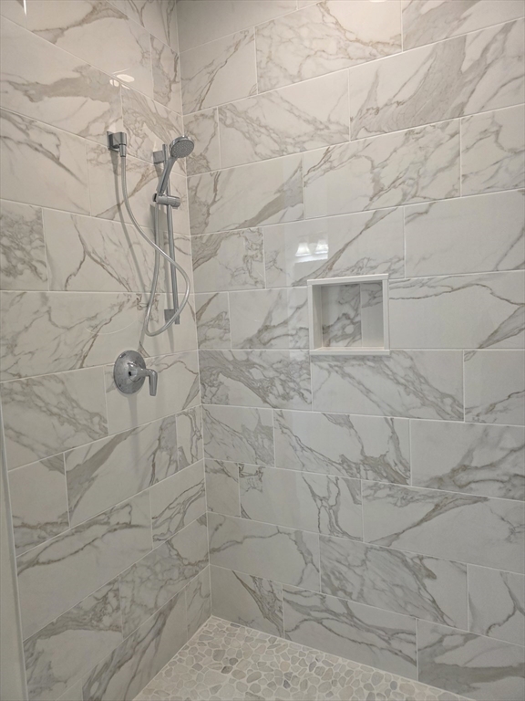 15 Fidelity Drive, Unit 70 Rutland, MA 01543 - Photo 6 of 7 a bathroom with a shower