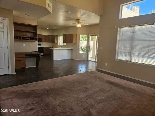 a kitchen with kitchen island granite countertop a sink stainless steel appliances and cabinets
