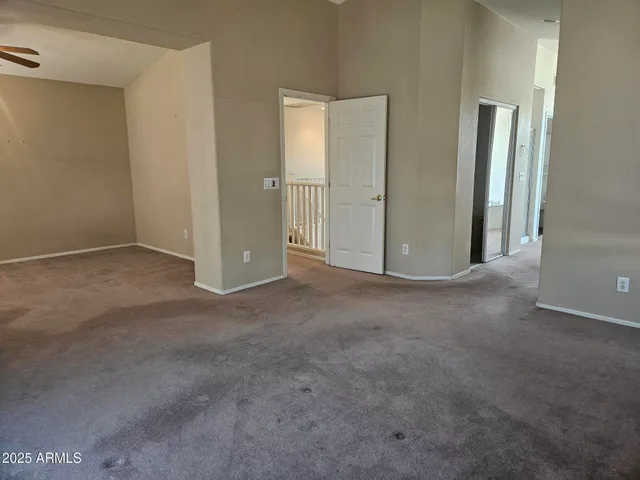 a view of a balcony with yard