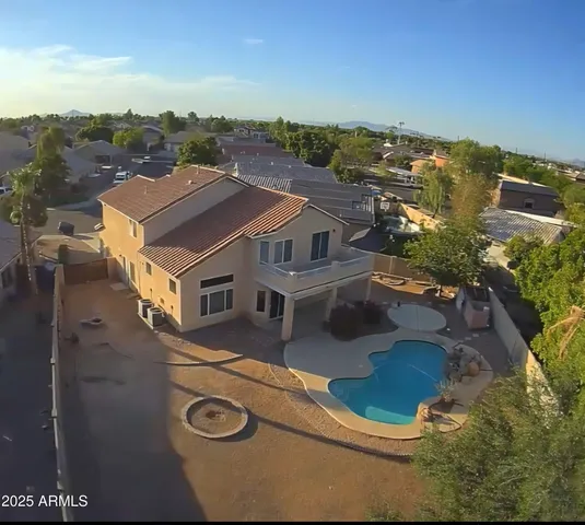 an aerial view of residential houses with outdoor space