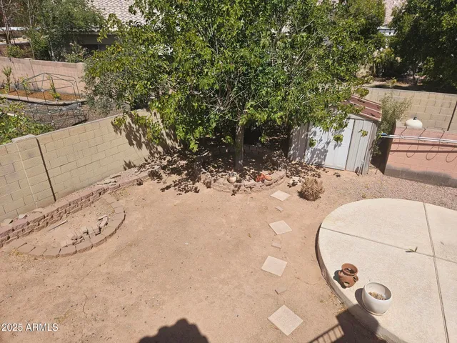 a view of a roof deck with couches and sky view