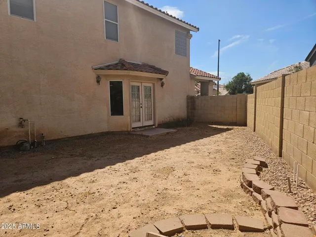 a view of a backyard of a house