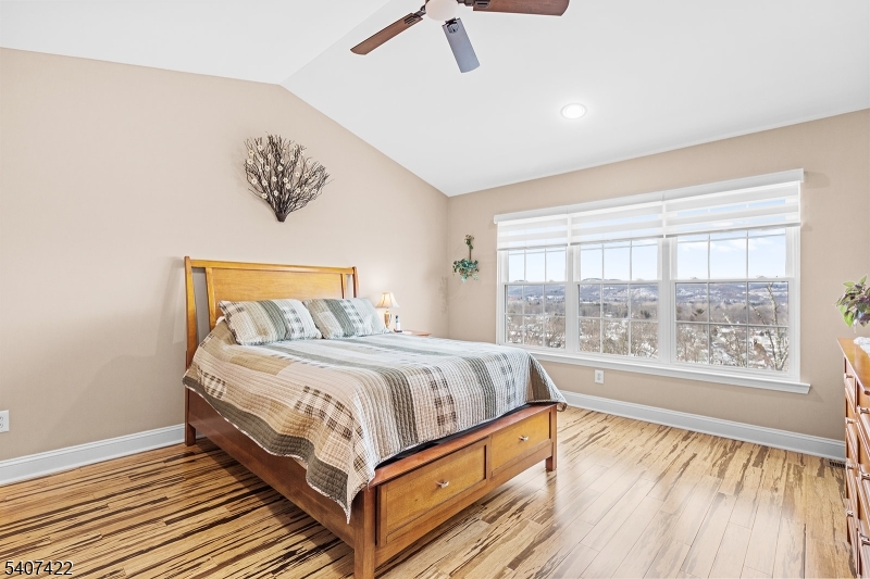 124 Ridge Drive Pompton Lakes, NJ 07442 - Photo 13 of 32 a bedroom with a bed and a large window