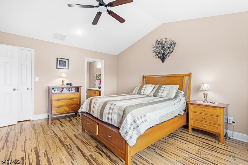 124 Ridge Drive Pompton Lakes, NJ 07442 - Photo 15 of 32 a bedroom with a bed and a dresser
