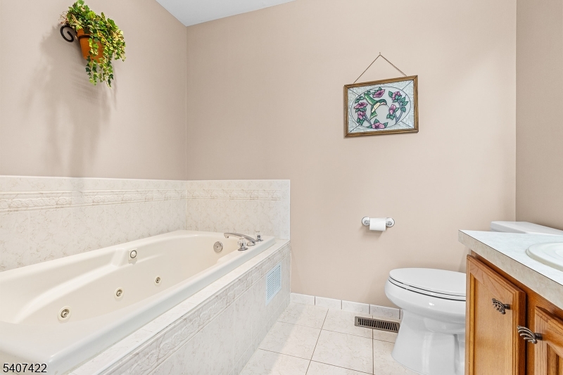 124 Ridge Drive Pompton Lakes, NJ 07442 - Photo 18 of 32 a bathroom with a bathtub and a toilet