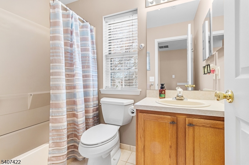 124 Ridge Drive Pompton Lakes, NJ 07442 - Photo 21 of 32 a bathroom with a sink a toilet and shower