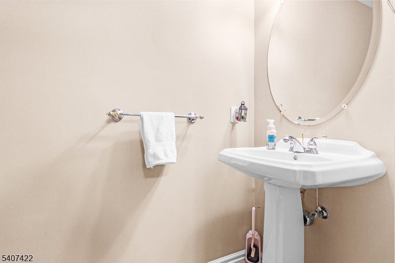 124 Ridge Drive Pompton Lakes, NJ 07442 - Photo 27 of 32 a bathroom with a sink and mirror