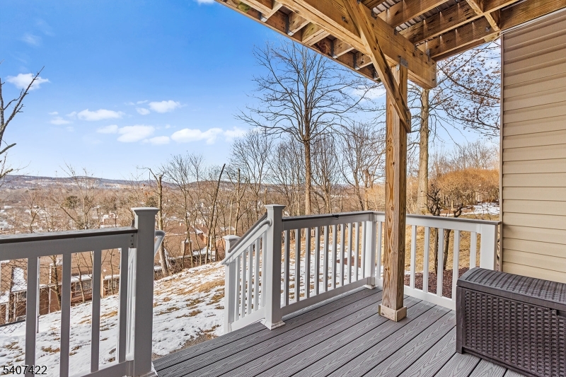 124 Ridge Drive Pompton Lakes, NJ 07442 - Photo 28 of 32 a view of a balcony with wooden floor and fence and city view