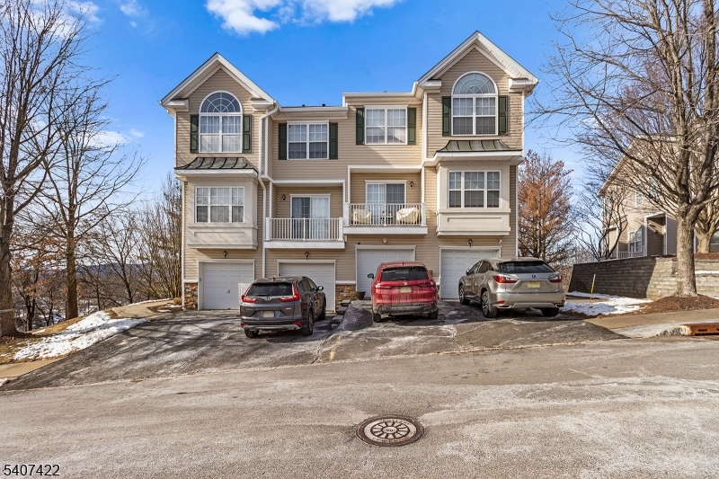124 Ridge Drive Pompton Lakes, NJ 07442 - Photo 32 of 32 a view of a street that has couple of cars parked on road