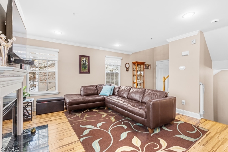 124 Ridge Drive Pompton Lakes, NJ 07442 - Photo 8 of 32 a living room with furniture or couch and a fireplace