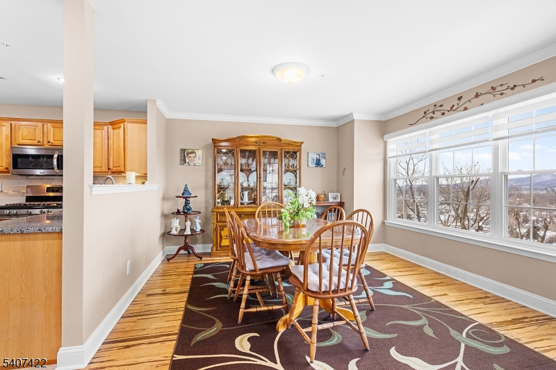 124 Ridge Drive Pompton Lakes, NJ 07442 - Photo 9 of 32 a dining room with furniture and wooden floor