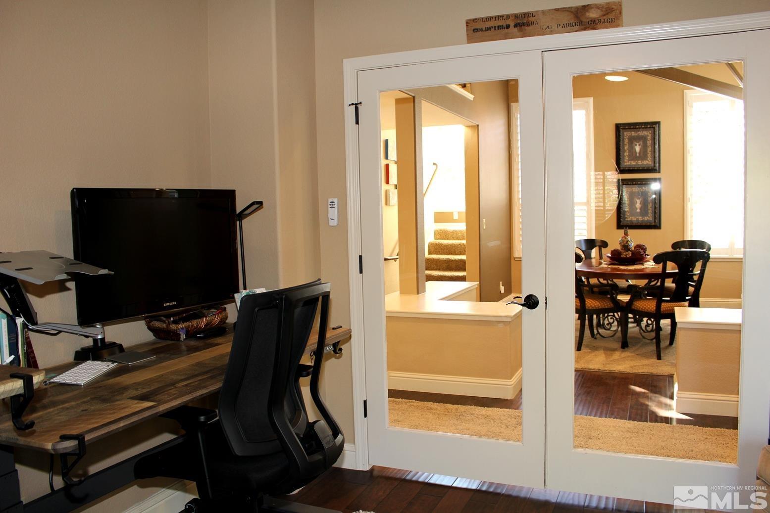 4115 Christy Way Reno, NV 89519 - Photo 20 of 40 a view of a workspace with furniture and a window