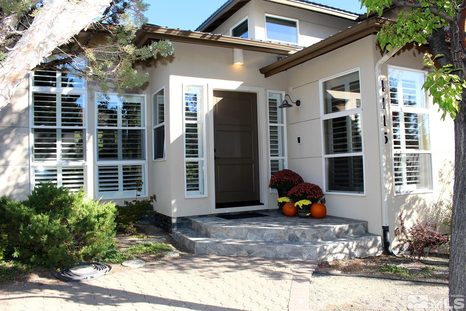 4115 Christy Way Reno, NV 89519 - Photo 2 of 40 a view of a house with a yard