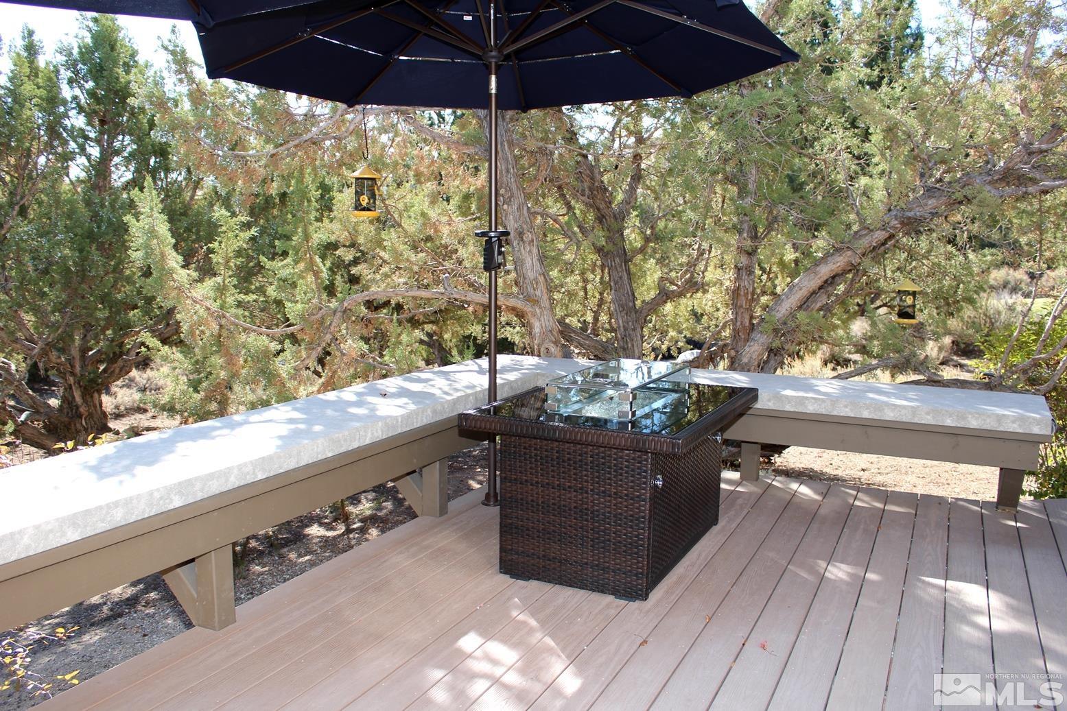 4115 Christy Way Reno, NV 89519 - Photo 35 of 40 a view of a roof deck with wooden floor and fence