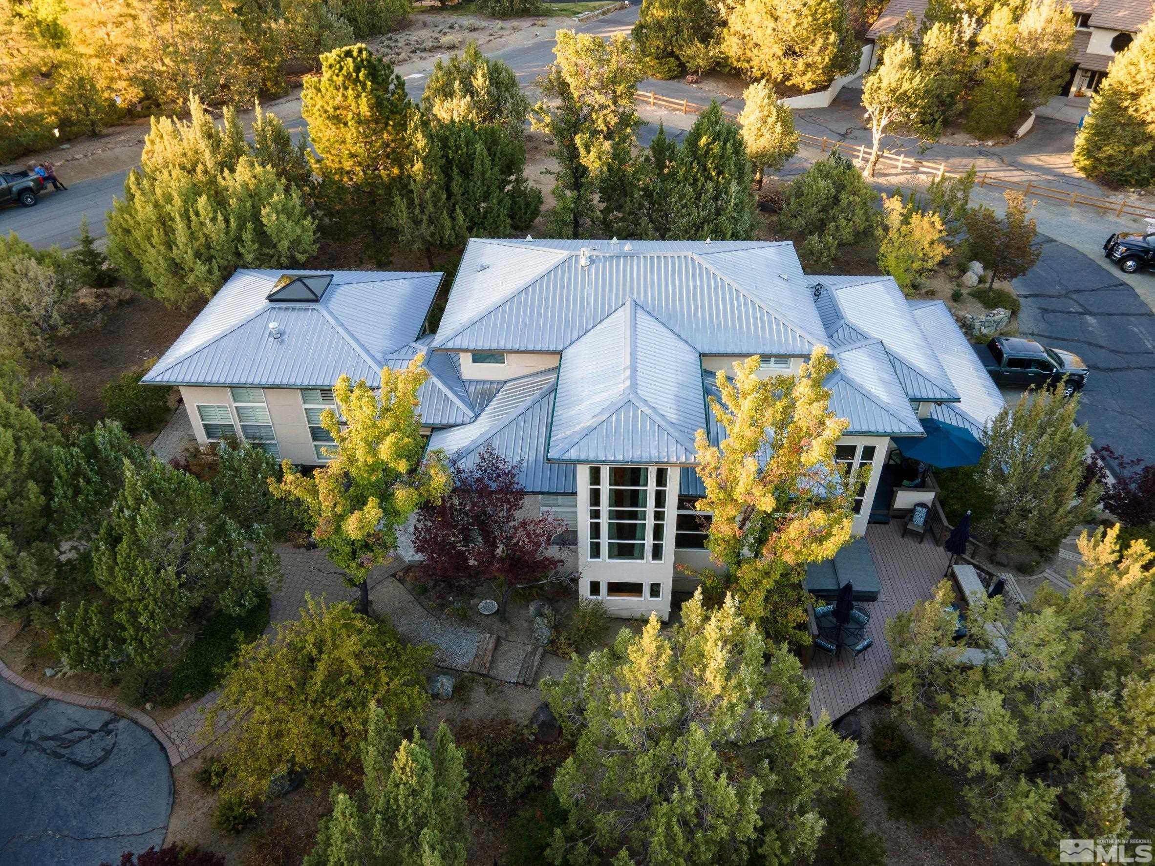 4115 Christy Way Reno, NV 89519 - Photo 4 of 40 an aerial view of a house with a big yard and large trees