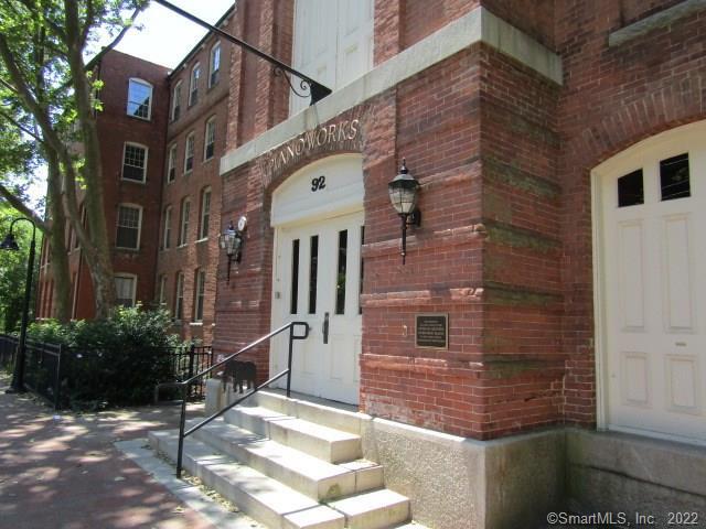 a brick building with a large windows
