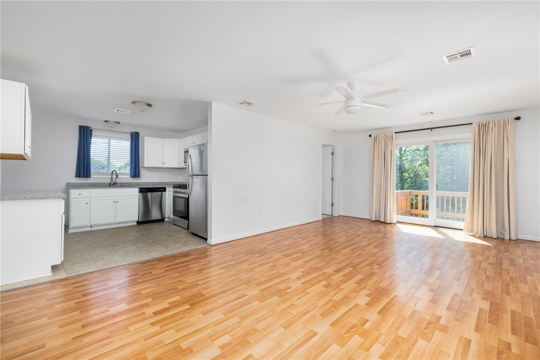 47 North Road Jamestown, RI 02835 - Photo 6 of 27 Second Floor Unit B Living Room and view of Kitchen