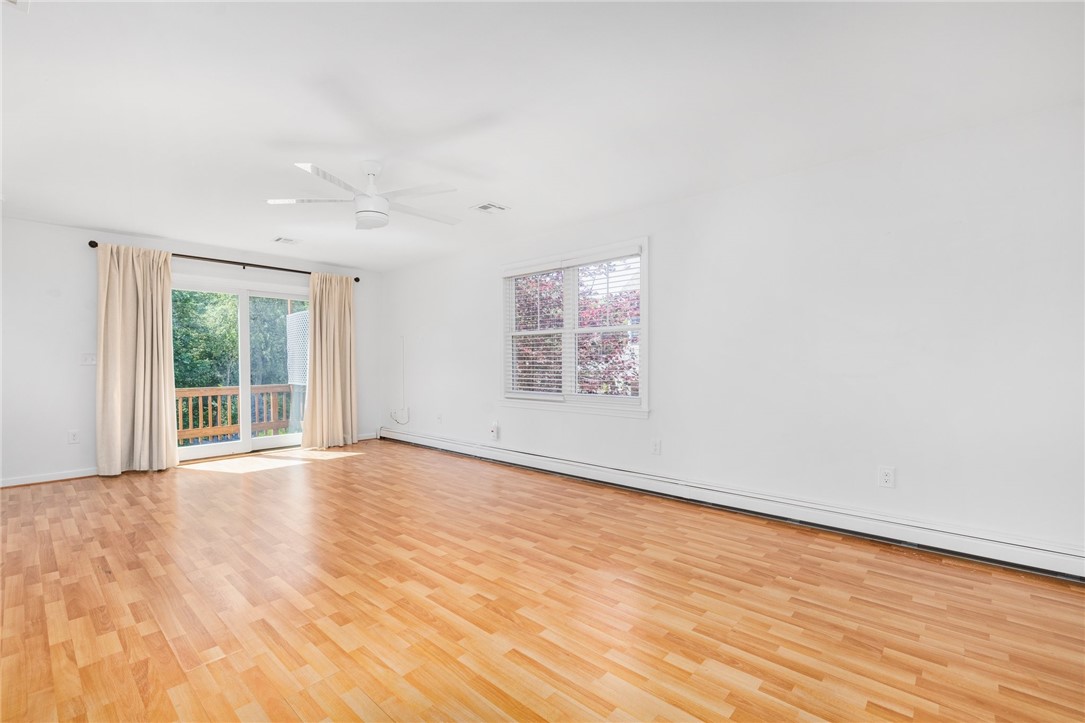 47 North Road Jamestown, RI 02835 - Photo 7 of 27 Living Room with sliders leading onto upper deck